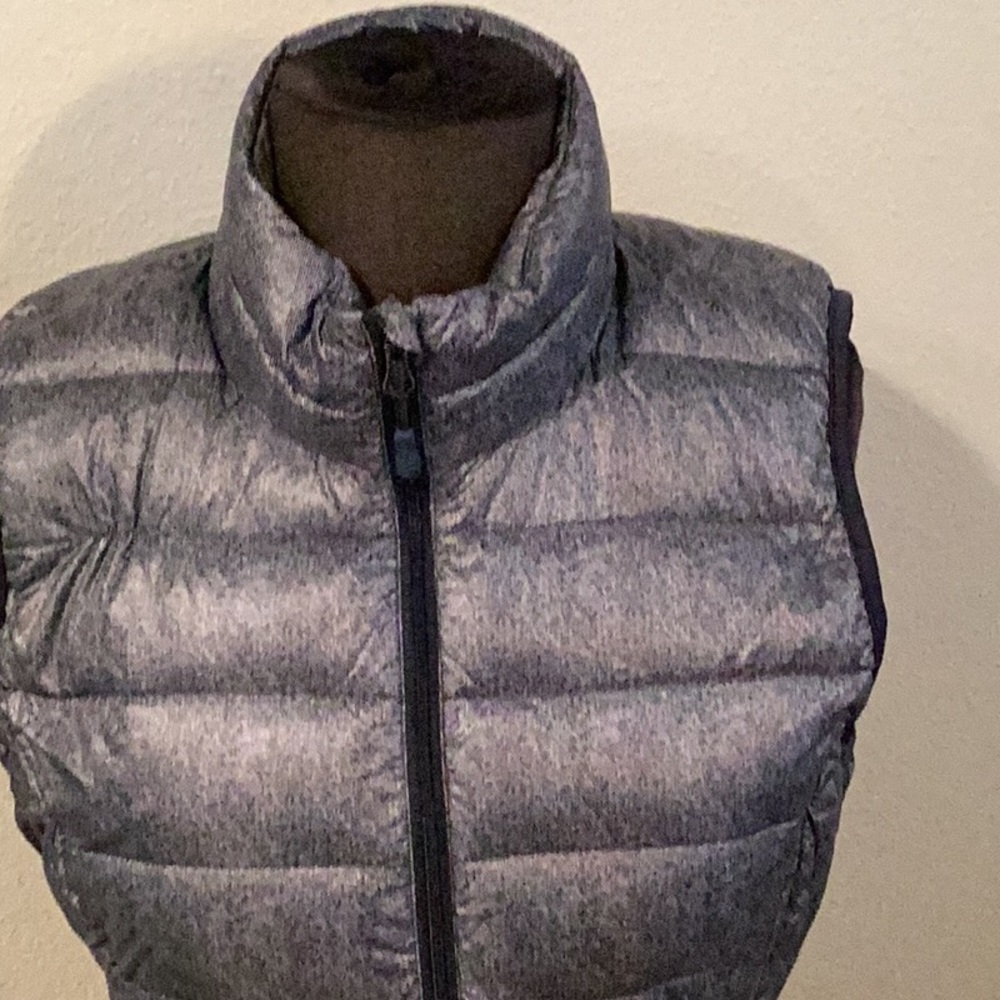 Navy blue vest. Size medium. Comes with matching pouch.